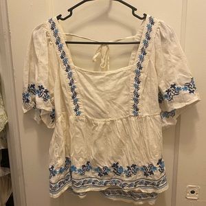 White top with blue details